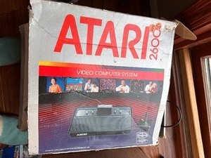 lot 61 image: Atari 2600 in Box Video Computer Systems with Video Touch Pad, Power Cords, Two JoyStick Controllers, and Q-Bert Game - Not Tested