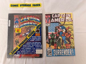 lot 132 image: Marvel Comics Captain America 397 Feb with Comic Storage Pages - New in Packaging & Captain America Surrender #345 Sept Comic Books