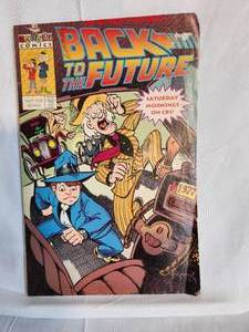 lot 257 image: Variety of MovieTV Show Inpsired Comics - Shaggy Dog, Ghostbusters, X-Files, Cobra Kai, & Back to the Future