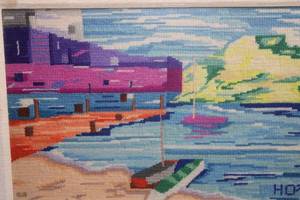 lot 44 image: The Dock Needlepoint framed in glass with over lay of canvas matting.