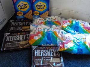 lot 121 image: 2 Boxes Honey Maid Graham Crackers, 4 bags Jet Puffed Marshmallows and 3 - 6 packs Full Size Candy Bars