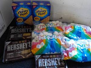 lot 123 image: 2 Boxes Honey Maid Graham Crackers, 4 bags Jet Puffed Marshmallows and 3 - 6 packs Full Size Candy Bars