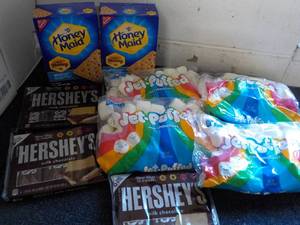 lot 125 image: 2 Boxes Honey Maid Graham Crackers, 4 bags Jet Puffed Marshmallows and 3 - 6 packs Full Size Candy Bars