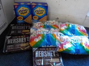 lot 126 image: 2 Boxes Honey Maid Graham Crackers, 4 bags Jet Puffed Marshmallows and 3 - 6 packs Full Size Candy Bars
