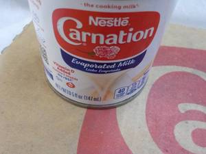 lot 150 image: 24 ct 5 oz Cans Nestles Carnation Evaporated Milk - best date 08312023
