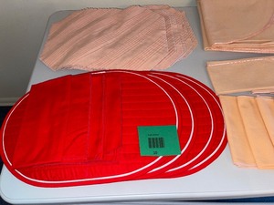 Assorted dining placemats, napkins, and table cloth