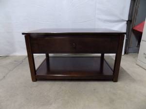 Coffee table with lift up top