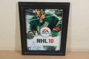 lot 202 image: Signed EA Sports NHL 10 Framed Picture Cal Clutterbuck #22