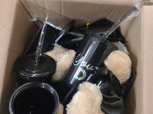 Box of Graduation themed stuffed animals and cups