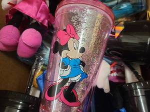 Box of Graduation themed Disney stuffed animals, cups and snowglobes