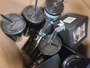 Box of Graduation themed mugs, picture frames and stuffed animals