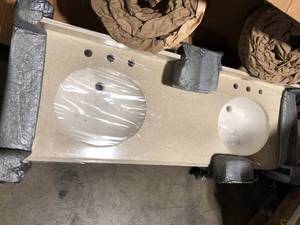 lot 29 image: St. Paul 61 in. W x 22 in. D Cultured Marble White Round Single Sink Vanity Top in White customer return see pictures