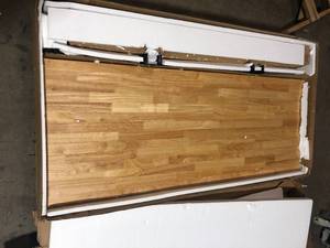 lot 38 image: Husky 62 in. W x 24 in. D Adjustable Height Solid Wood Top Workbench Table in Black Costumer Returns See Pics