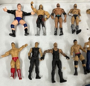 Lot of 49 Wrestling Action Figures Including Steve Austin, The Rock, Etc.