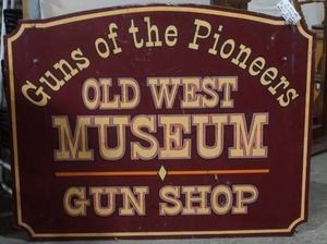lot 34 image: Gun shop sign