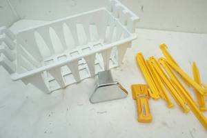lot 124 image: Plastic freezer basket, stud finder and hitch cap