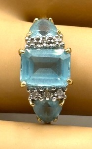 lot 12 image: Elegant 10K Gold Ring with Topaz and Diamond Stones