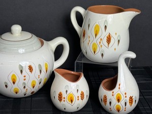 lot 82 image: Vintage Mid Century Modern Amber Glo Stangl Pottery Pieces includes Stangl Amber Glo Teapot