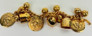 lot 111 image: Charming Vintage Gold Tone Charm Bracelet