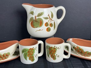 lot 115 image: Vintage Stangl Pottery Orchard Song Gravy Boat and Underplate, Two Mugs and Pitcher