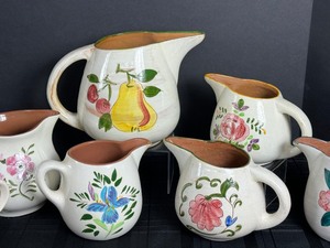 lot 122 image: Seven Vintage Stangl Pottery Pitchers