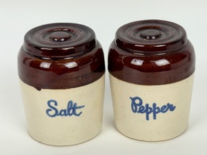 lot 212 image: Pair of Western Stoneware National Second Bank Salt and Pepper Shaker Set