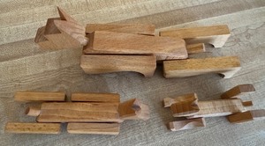 lot 159 image: Set of Three Signed Wood Dog Figurines