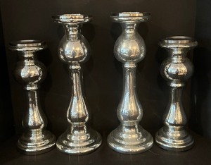lot 194 image: Four Shimmering Silver Candle Holders by Williamsburg