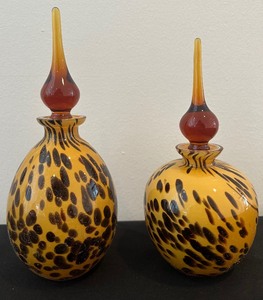 lot 501 image: Three Glass Animal Print Bottles