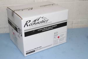 lot 30 image: New in Box Rockustics Rocquette Brown Rock-Shaped Outdoor Weatherproof Patio  Landscaping Pro Audio Speaker