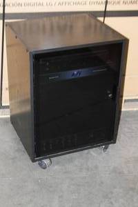 lot 76 image: Black Laminate Audio Video Equipment Rack on Casters with Rack Rails Smoked Glass Plexi Door Pro Audio Amplifier & More