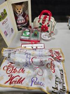 lot 76 image: Christmas Silk Scarf NWT, VTG Cat & Mouse Single Candle Holder, Sterling NIB Christmas Charm Bracelet w 3 Charms, Pointsettia Cookie Jar Purse, Happy Holiday Bear NIB Franklin Mint