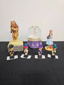 lot 16 image: VTG J. Garland as Dorothy Figurine & S. Mann as Cowardly Lion Musical Figurine, 4 Mini Bobbleheads, T. Lipinski Snow Globe