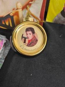 lot 5 image: Elvis All Shook Up 45 record, Postage Stamps, Bradford Exchange Christmas Ornament, Elvis Canvas Picture