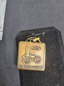 lot 174 image: Ford Motor Co 10 Years of Service Key Chain  (4) Ford Customer Driven Lapel Pin Green, 1 Ford First in Quality Blue Lapel Pin