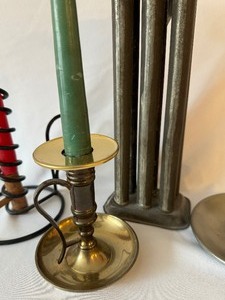 lot 28 image: Antique Metal Candle Mold and  Three Decorative Candle Holders