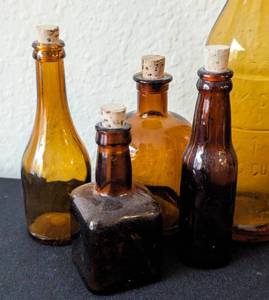 lot 107 image: Assorted Amber Glass Bottles