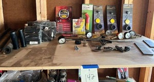 lot 142 image: Garage Shelf Contents (within Blue Tape) - Gopher Gassers, Tire Gauges, Vent Caps and More