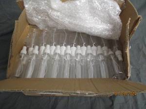 A bunch of misting bottles with caps