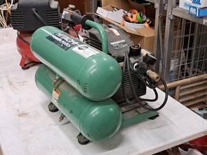 lot 54 image: Hitachi 4-Gallon 125-PSI 2-HP Air Compressor with Dual Tanks EC12