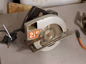 lot 123 image: Montgomery Ward Powr Kraft 7-14 Circular Saw XBA80016A
