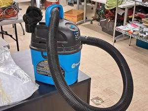 lot 310 image: Vacmaster 1.5-Gallon 2-HP Shop Vacuum with Hose and Attachment