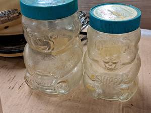 lot 456 image: Lot of (2) Skippy Glass Peanut Butter Jars with Lids