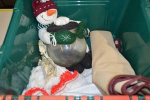 lot 28 image: Tub of Assorted Christmas Decor - Snowman Bowl, Christmas Tree Skirt, Rug