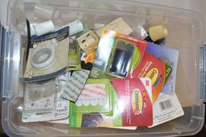 lot 49 image: Tub of Assorted Command Strips and Other Wall Hangers