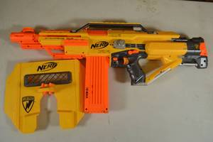lot 110 image: NERF N-Strike Stampede ECS Fully Automatic Blaster Semi-Functional, Comes with 18-Round Magazine, Shield and Expanding Handgrip Attachments - Ammo and Batteries Not Included