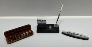 lot 9 image: Group Of Misc. Pens And 1980s Desk Perpetual Calendar & Pen Holder On Marble Base