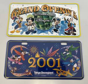 lot 129 image: Vintage Collectible 2001TOKYO Disneyland & TOKYO DisneySEA Grand Openong License Plates (New Factory Sealed In Plastic Sleeve)
