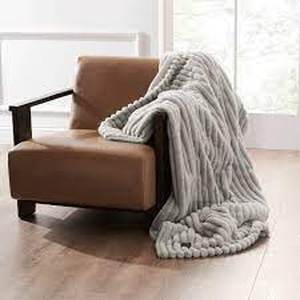 lot 109 image: 50x60 Coziest Electric Throw Blanket - Brookstone - Some discoloration on blanket, see photos