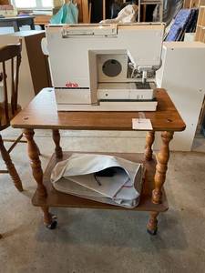 lot 80 image: ELNA Swiss Made Sewing Machine on Wooden Stand